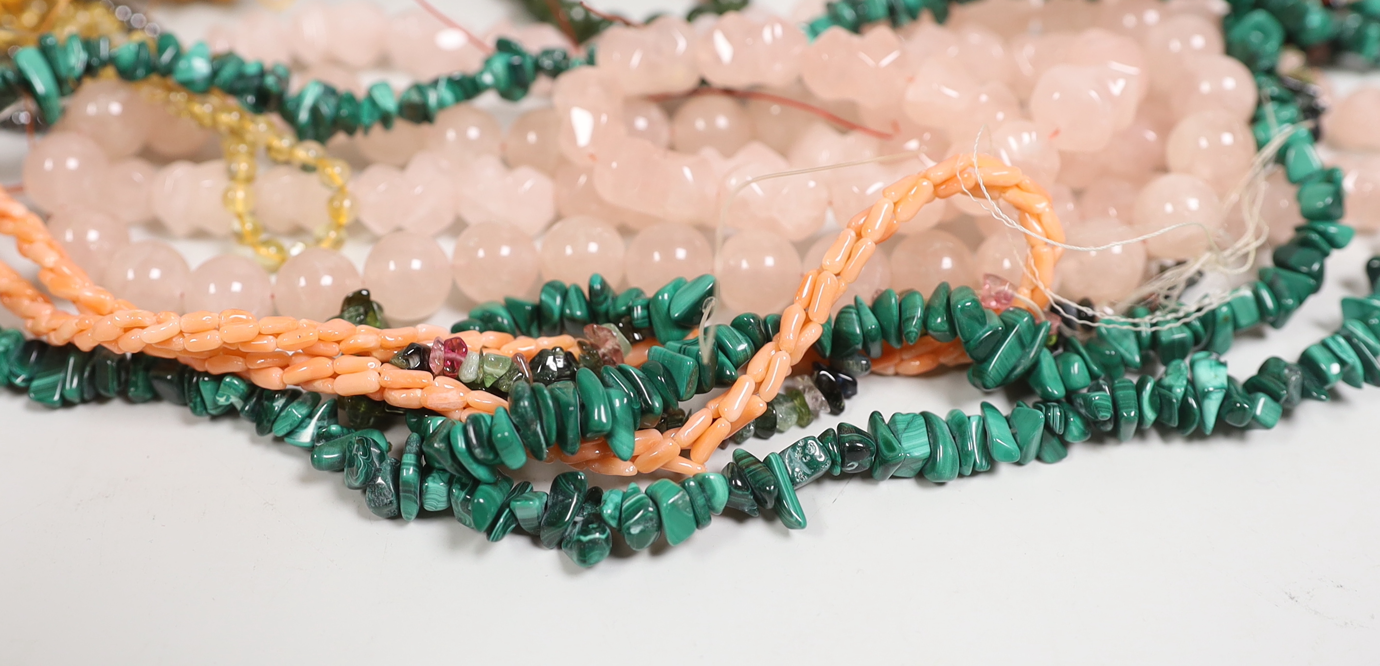 Assorted necklaces including malachite, agate and pink quartz.